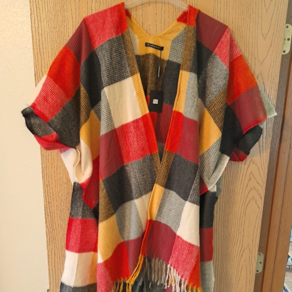 AUTMN COLORED SWEATER/COVER UP to be worn over a blouse/top.